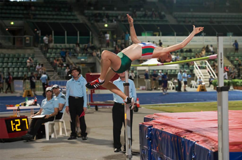 Athlete performing a high jump at the Athletic Centre pitch 