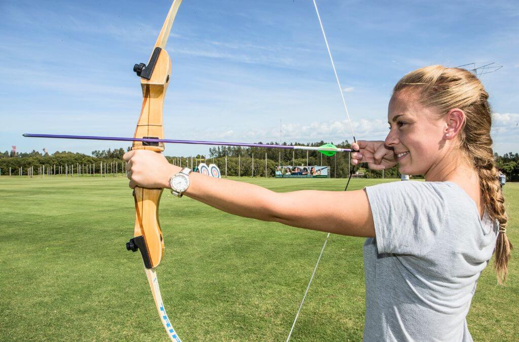 Girl drawing an archery bow